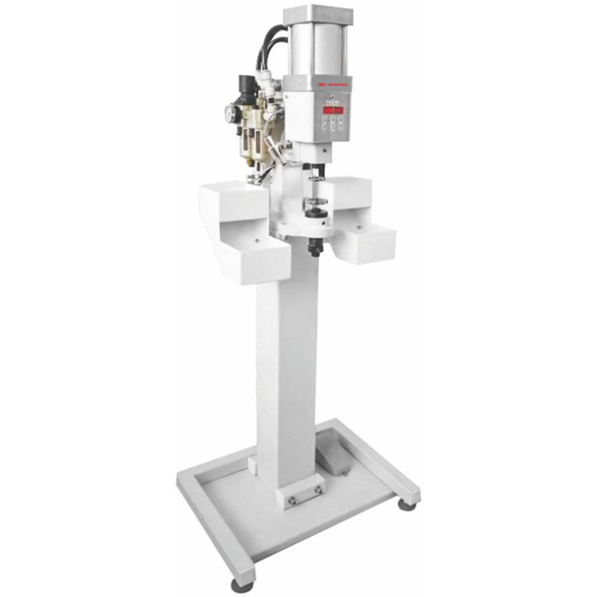 Pneumatic button attach machine