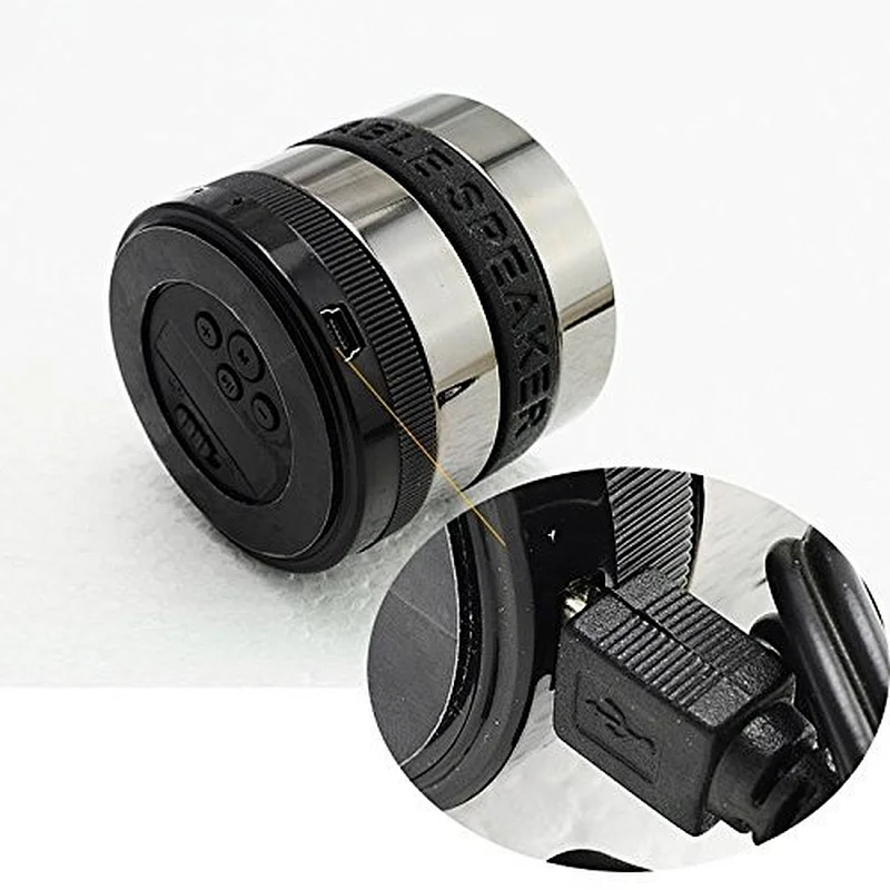 OEM Wholesale Wireless Round Fm Radio With Silicone Band Portable Super Bass Mini PC Metal Camera Lens Bluetooth Speaker