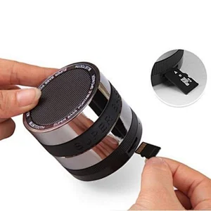 OEM Wholesale Wireless Round Fm Radio With Silicone Band Portable Super Bass Mini PC Metal Camera Lens Bluetooth Speaker