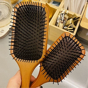 wooden paddle brush