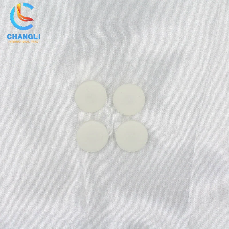 Garment denim four-in-one button