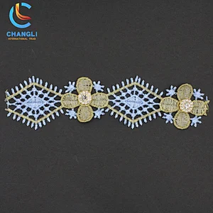 Snowflake and leaf hand-embroidered lace