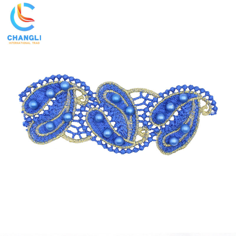 Blue hand-embroidered lace with thread ball