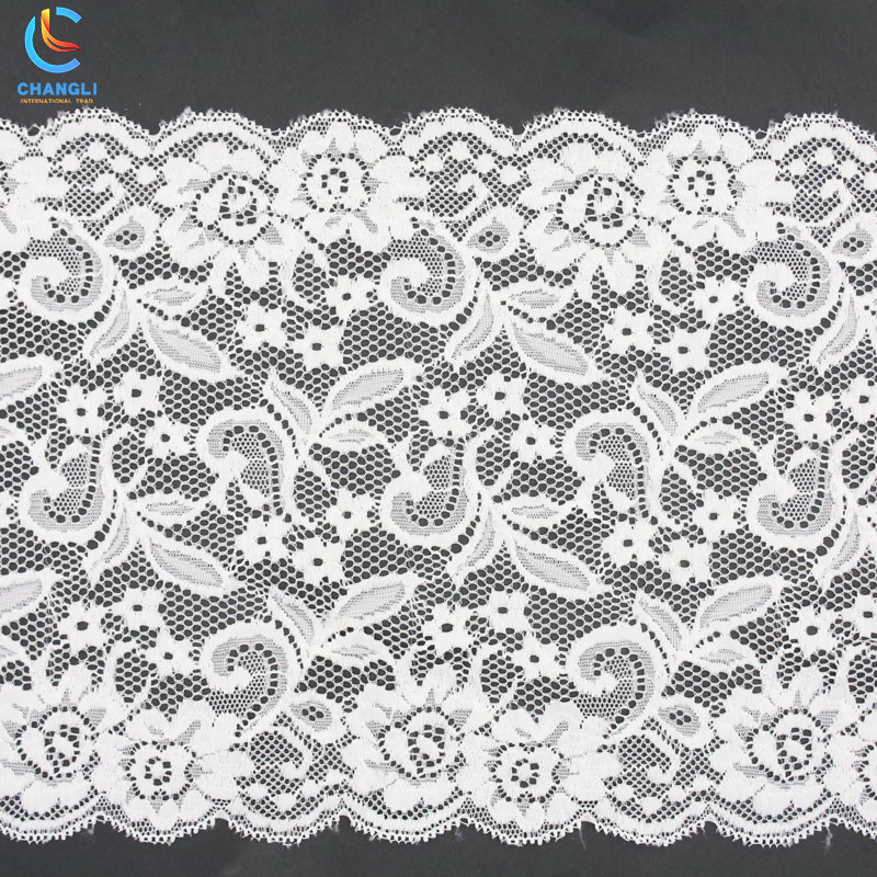 Transparent lace with small flowers and grass