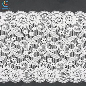 Transparent lace with small flowers and grass