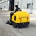 Yellow BT-BAW1800 warehouse floor sweeper in operation