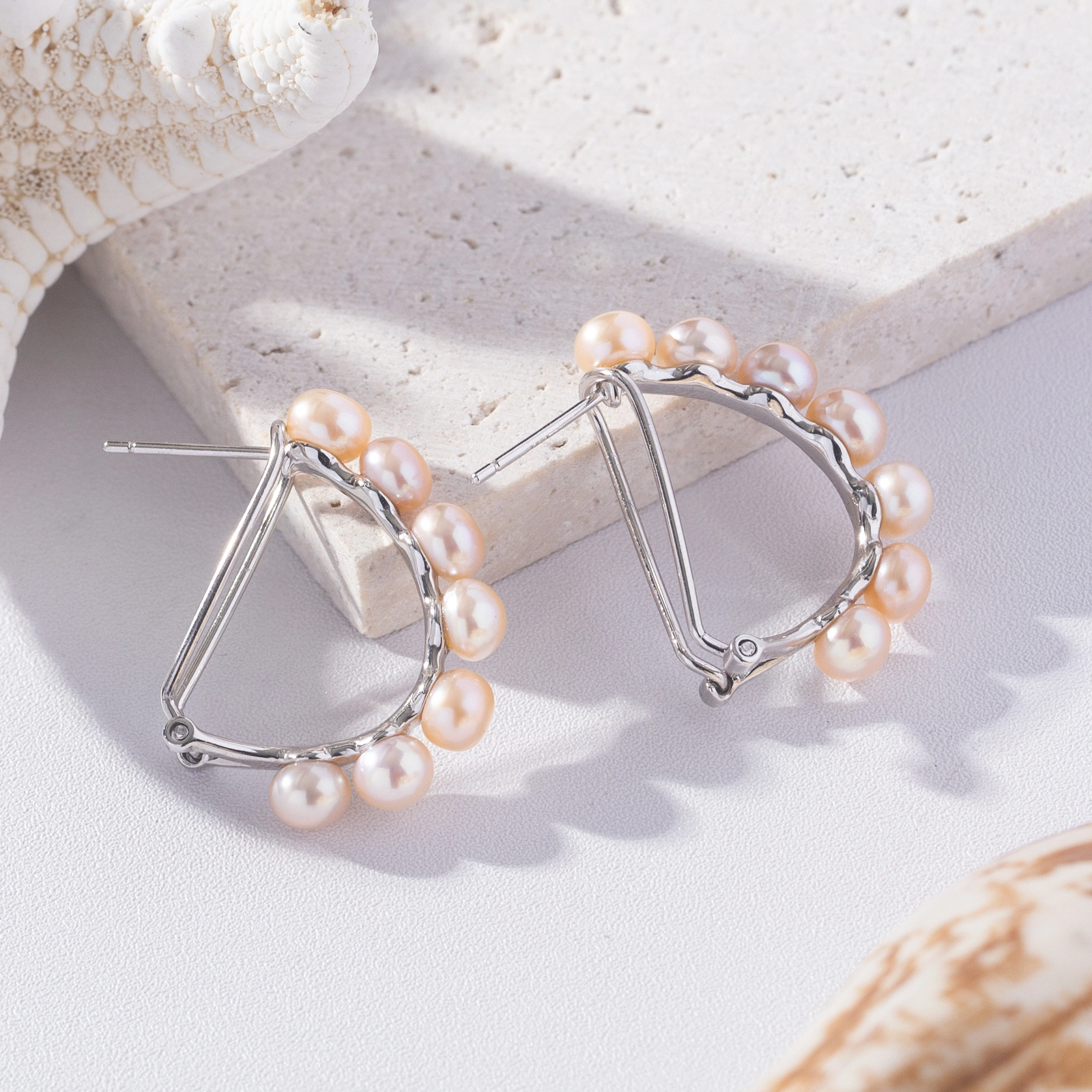 5-5.5mm pnk pearl silver omega earrings