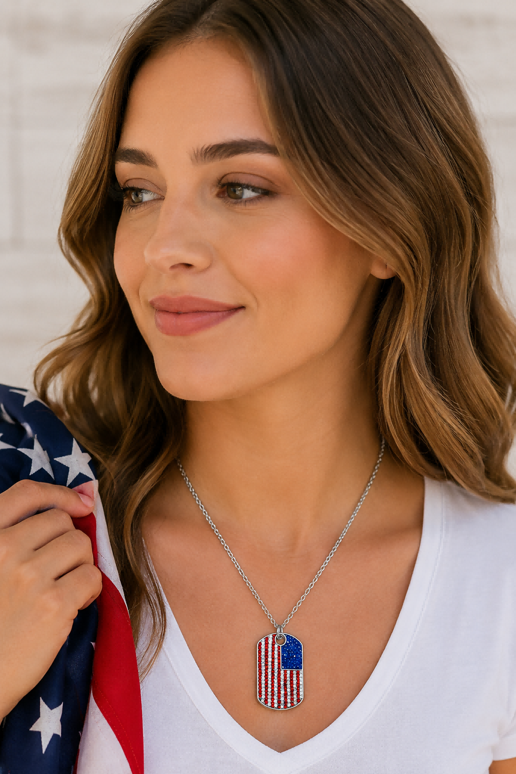 Model wearing patriotic USA flag dog tag cz necklace.