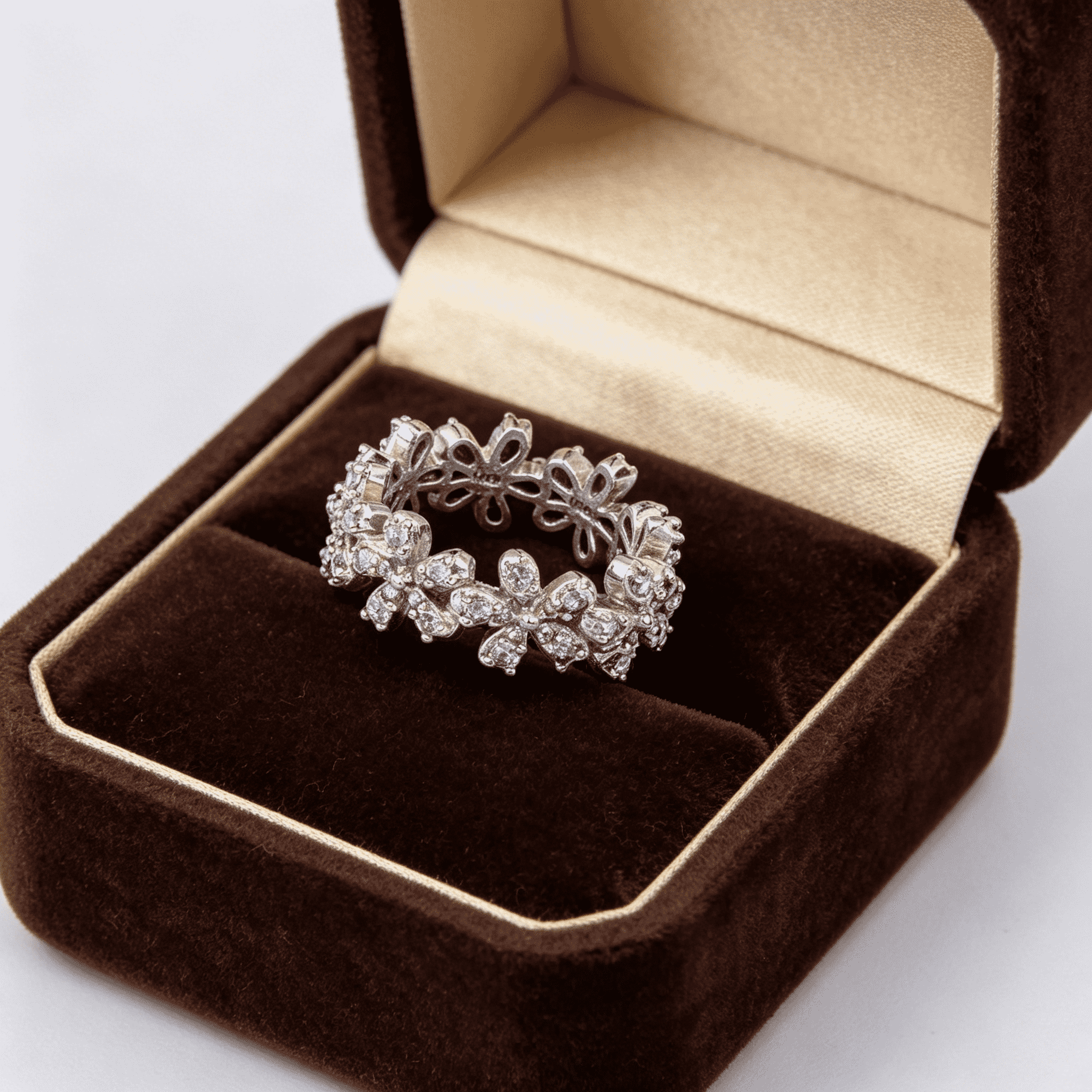 Full band constructed with connected 3D tiny flowers forming a wreath, hollow petal cut-outs on band back, intricate details on both front and reverse sides