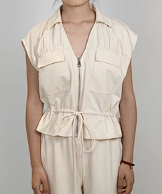 Blusa sin mangas con cuello polo y cremallera para mujer con bolsillos en el pecho