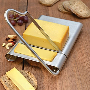Stainless steel cheese slicer with a spare blade