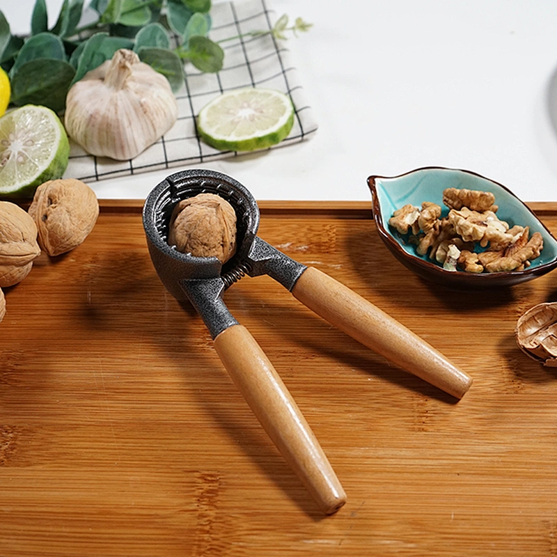 Easy to use food grade metal kitchen manual nuts cracker machine with wood handle nut cracker soldier