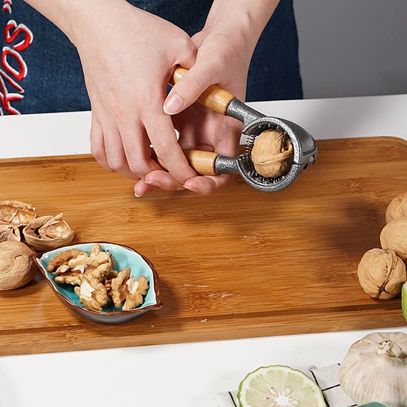 Easy to use food grade metal kitchen manual nuts cracker machine with wood handle nut cracker soldier