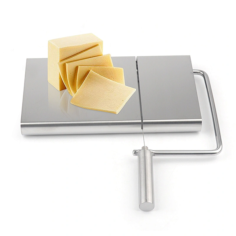 Stainless steel cheese slicer with a spare blade