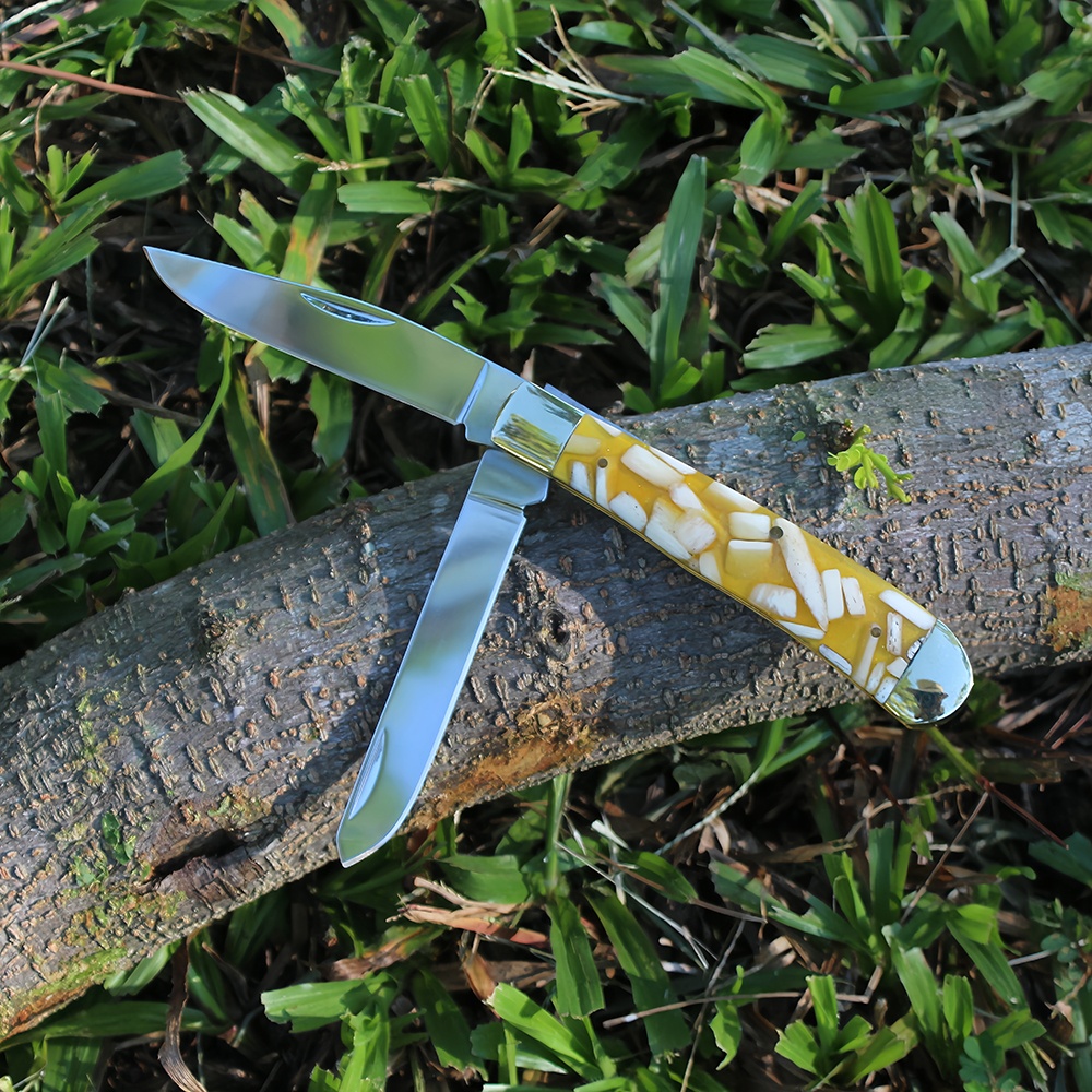 double bladed knife with compact folding design for everyday carry