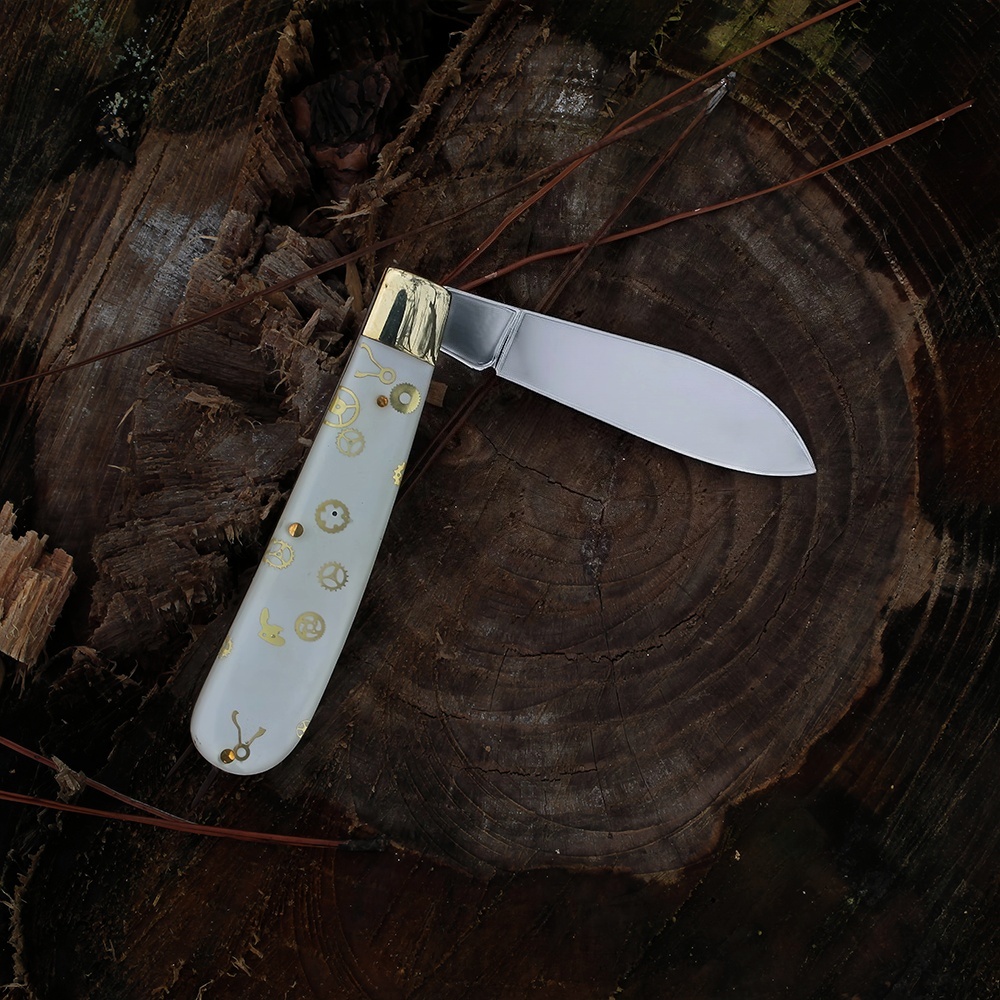 custom utility knife with a unique resin handle back viewed