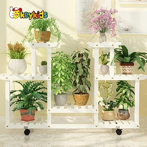 Wholesale classical multi-tier brown wooden plant stand with wheels W08H118B