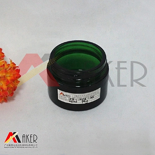 Hot selling empty 30ml green glass cosmetic jar with black lid