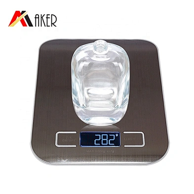 China manufacturer 100ml clear perfume glass bottle with gold aluminum sprayer acrylic cap