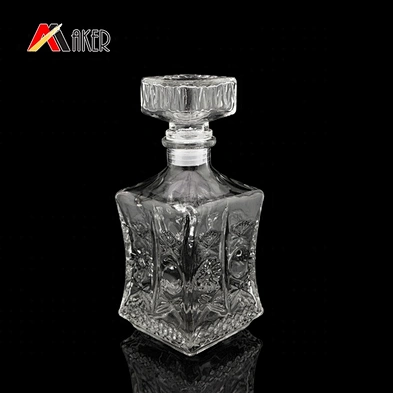 Factory price unique clear 750ml luxury engraving empty glass wine bottle with stopper for vodka