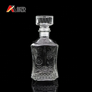 Factory price unique clear 750ml luxury engraving empty glass wine bottle with stopper for vodka