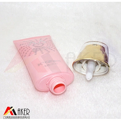 Supply 30ml super oval LDPE plastic cosmetic cream tube with gold aluminum covered airless pump