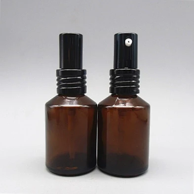 Slant shoulder round empty 60ml 100ml glass mist sprayer serum bottle with all metal pump