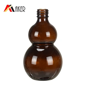 Wholesale cucurbit special 100ml amber cosmetic essential oil glass bottle with gold aluminum cap