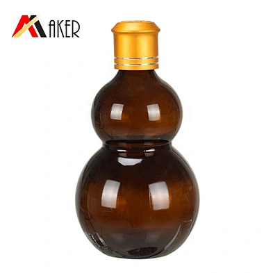 Wholesale cucurbit special 100ml amber cosmetic essential oil glass bottle with gold aluminum cap