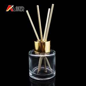 50ml clear glass aroma diffuser bottle with gold aluminum covered screw cap and plastic plug