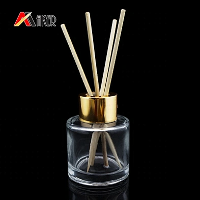 50ml clear glass aroma diffuser bottle with gold aluminum covered screw cap and plastic plug