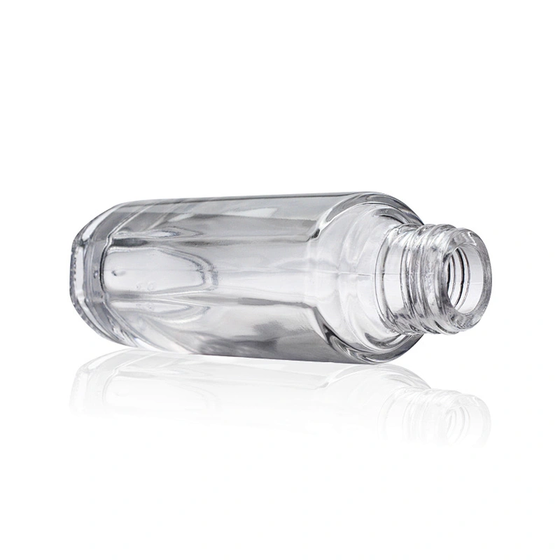 Hot sale empty  glass cosmetic 40ml transparent foundation black pump clear glass bottle with gold cap