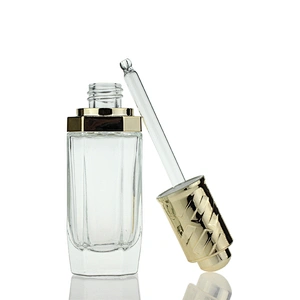 New Design  Glass Bottles Massage Oil Glass Dropper Bottle 35ml Clear Custom Serum Face Oil Bottles Container Manufacturers