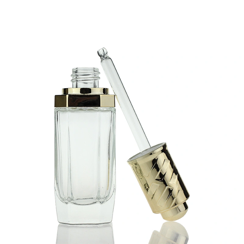 New Design  Glass Bottles Massage Oil Glass Dropper Bottle 35ml Clear Custom Serum Face Oil Bottles Container Manufacturers