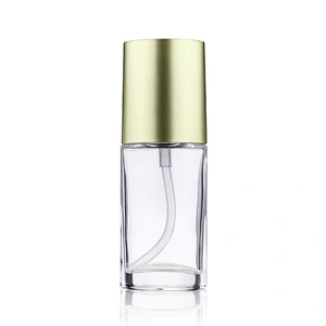 Hot sale empty  glass cosmetic 40ml transparent foundation black pump clear glass bottle with gold cap