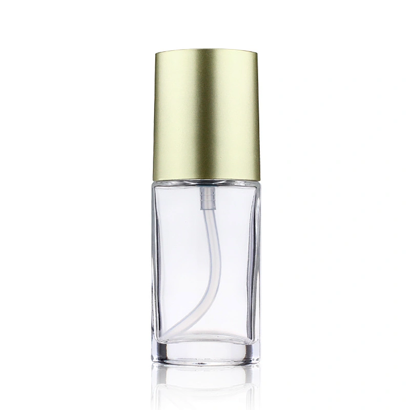 Hot sale empty  glass cosmetic 40ml transparent foundation black pump clear glass bottle with gold cap