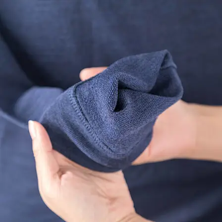 the sleeve of the Merino Wool Sweatshirt