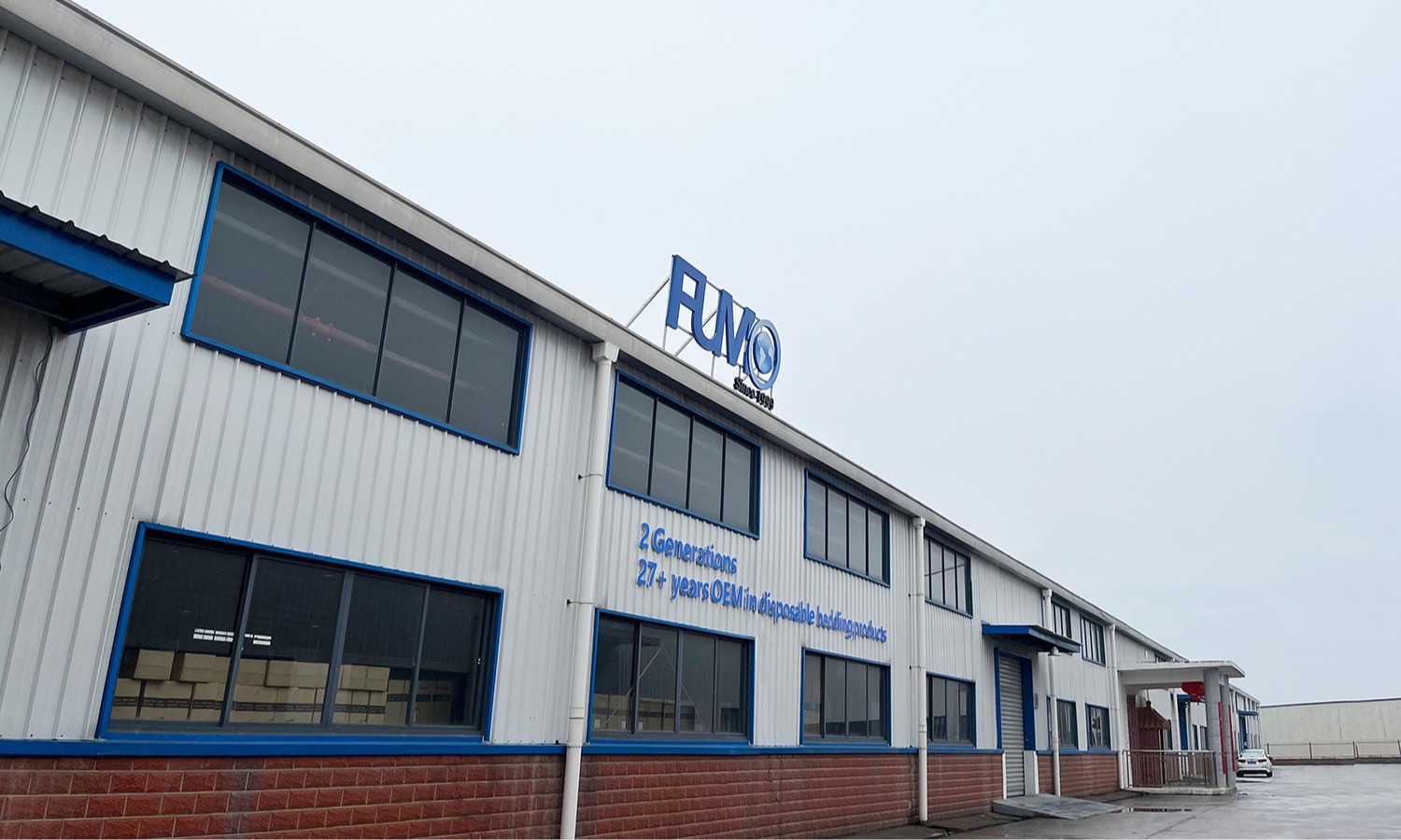 disposable sheet roll and bed sheets factory - fumo's historic and imposing factory gates since 1999