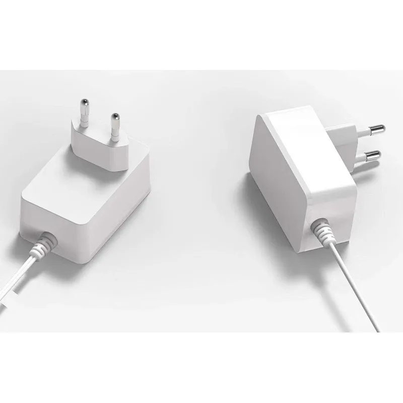 El adaptador de corriente al por mayor 12v1a se aplica a la fuente de alimentación de la pared del enrutador de la cámara CCTV con luz LED con buena calidad