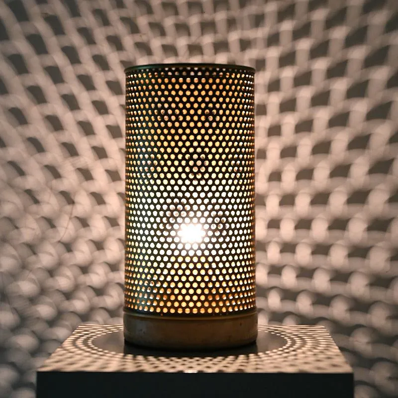 Simple antique brass hollow out metal cylinder travertine stone base table lamp for living room