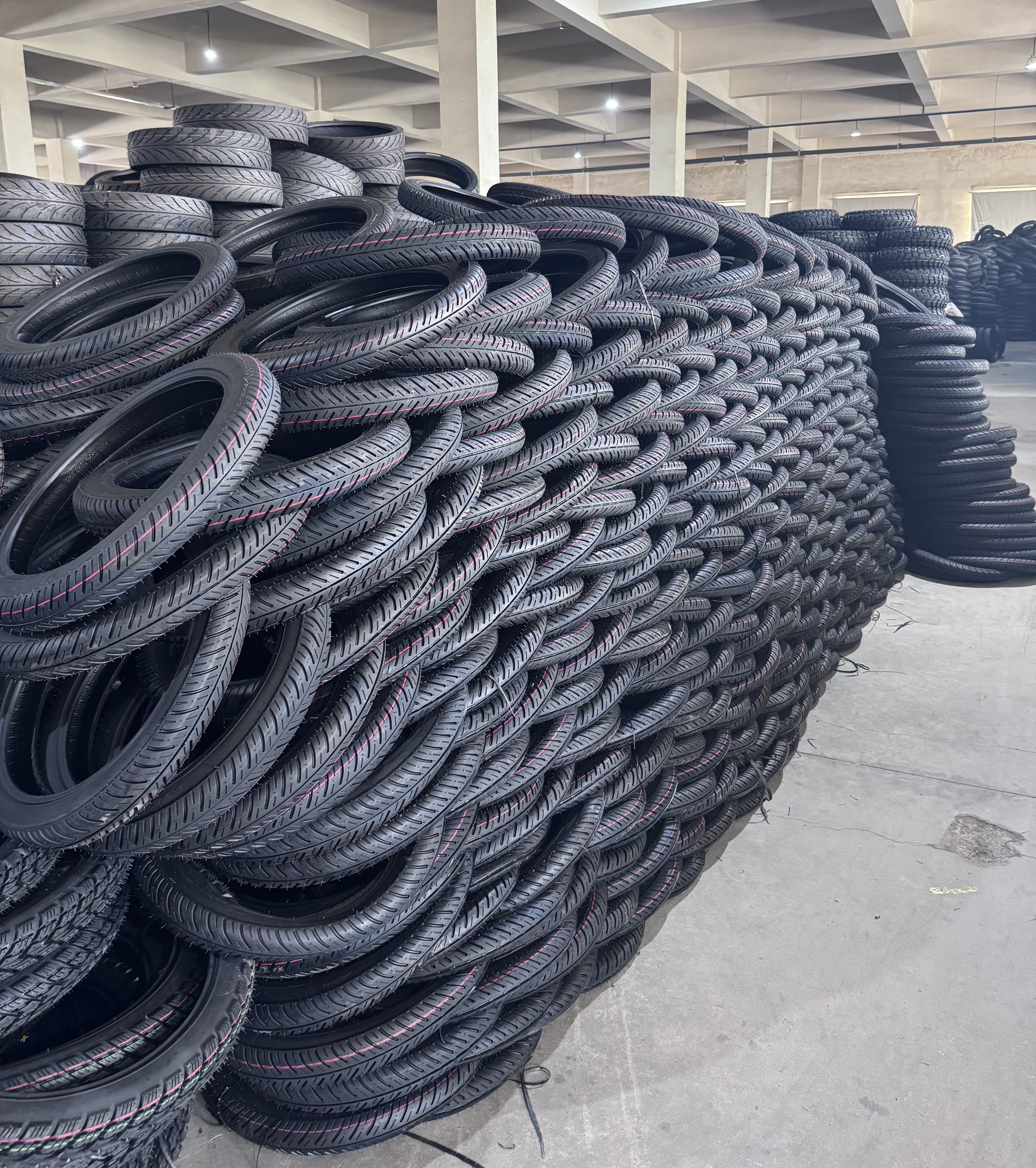 Finished motorcycle tires stored at DEJI TIRE warehouse in Qingdao China