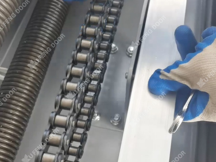 Industrial roll up door weekly cleaning aluminum panel wiping and guide track debris clearing