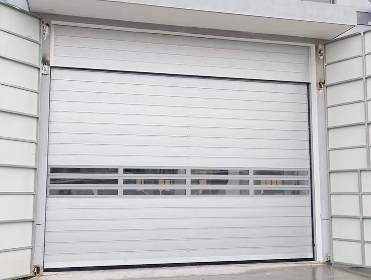 Commercial warehouse exterior featuring installed Xufeng industrial door systems