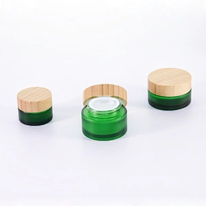 Cosmetic container green frosted glass jar with bamboo wooden lids for face cream jar