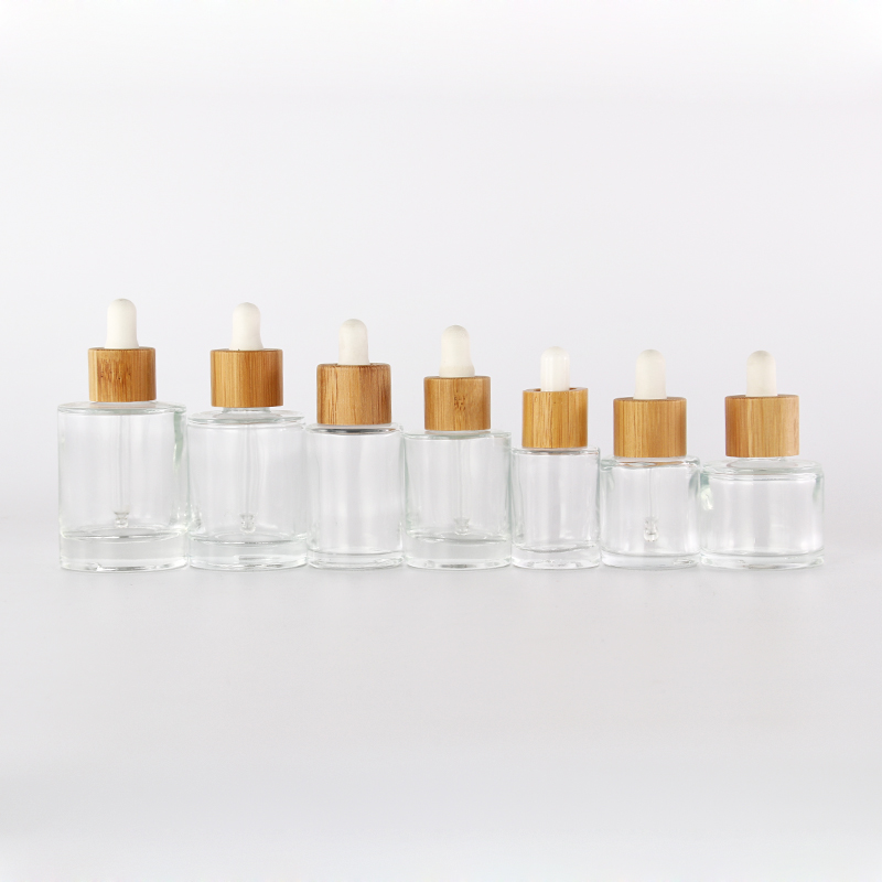 Wholesale 15ml 20ml 30ml 50ml Empty Clear Cosmetic Glass Essential Oil Dropper Bottles with Bamboo lids