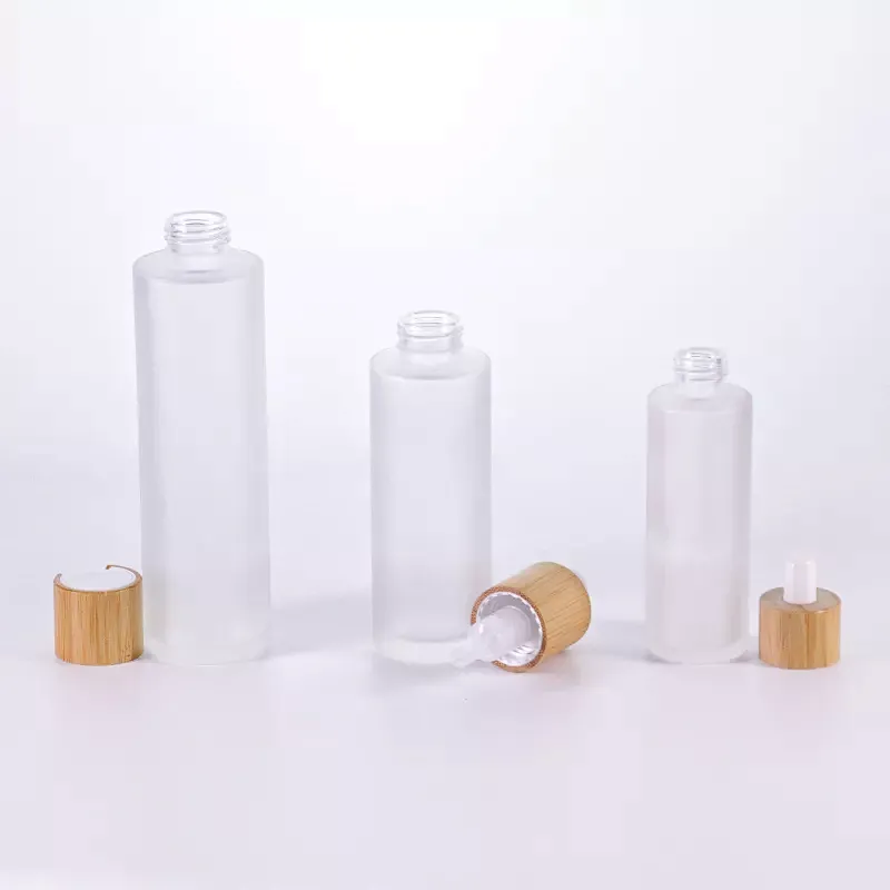 Cosmetic packaging 30ml 50ml 60ml 100ml 120ml 1oz 2oz 4oz flat shoulder clear frosted glass lotion bottle with bamboo pump cap