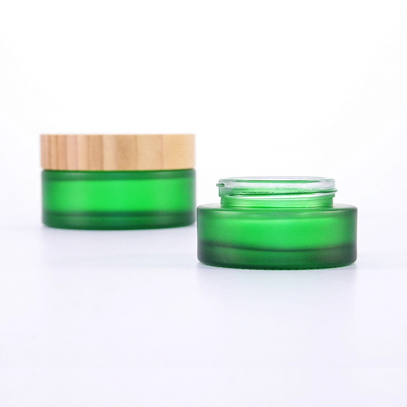 Hot sale Cosmetic Glass Jar Frosted Green 50g 100g Glass Cream Jar with Bamboo Lids