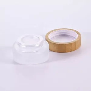 Cosmetic packaging 30ml 50ml 60ml 100ml 120ml 1oz 2oz 4oz flat shoulder clear frosted glass lotion bottle with bamboo pump cap