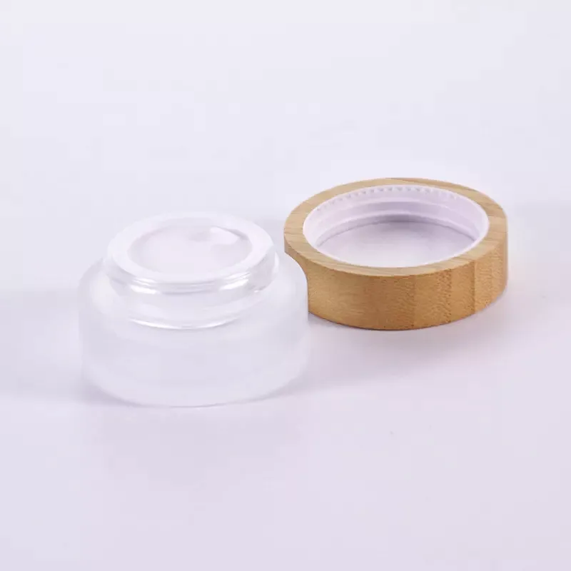 Cosmetic packaging 30ml 50ml 60ml 100ml 120ml 1oz 2oz 4oz flat shoulder clear frosted glass lotion bottle with bamboo pump cap