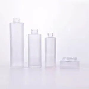 Cosmetic packaging 30ml 50ml 60ml 100ml 120ml 1oz 2oz 4oz flat shoulder clear frosted glass lotion bottle with bamboo pump cap